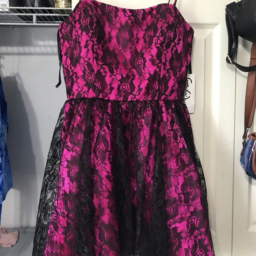 Pink dress with black lace.